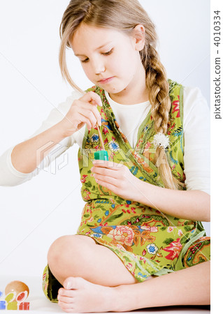 Young girl with green paint 4010334