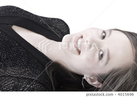 Beautiful model lying on the studio floor 4015696