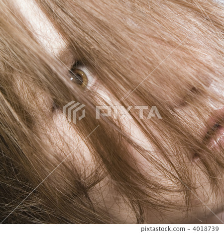 Redhead hiding behind her own hair 4018739