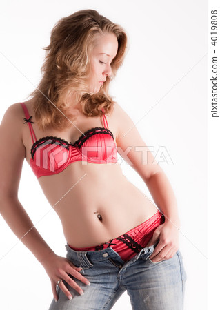 Undressing woman in red lingerie and jeans only 4019808