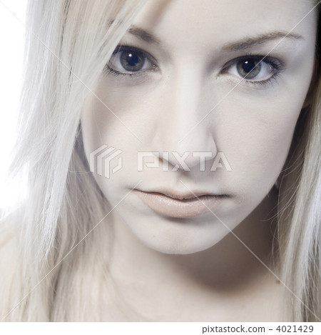 Studio portrait of a pouting young blond woman Studio portrait of a pouting young blond woman 4021429