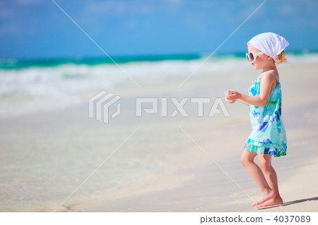 Little playful girl at beach 4037089
