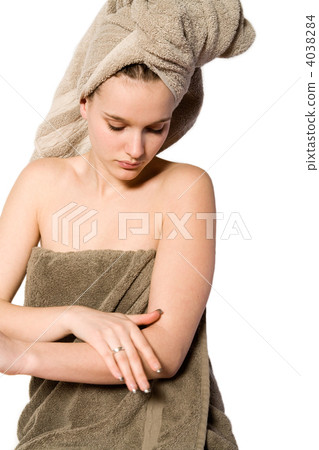 Young woman appying some creme 4038284