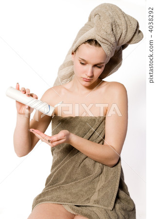 Woman is getting some creme on her hand Woman is getting some creme on her hand 4038292