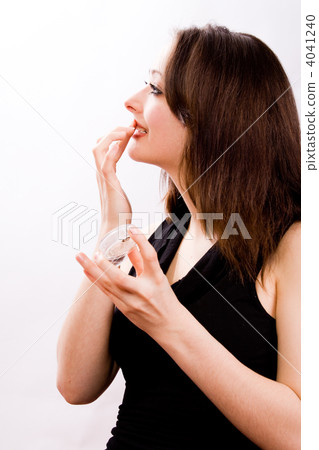 Cosmetic girl is touching her lips 4041240