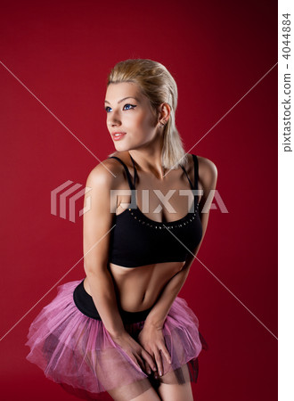 Athletic young woman posing in dance rose costume Athletic young woman posing in dance rose costume 4044884