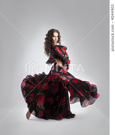 Woman dance in gypsy red and black costume Woman dance in gypsy red and black costume 4044903