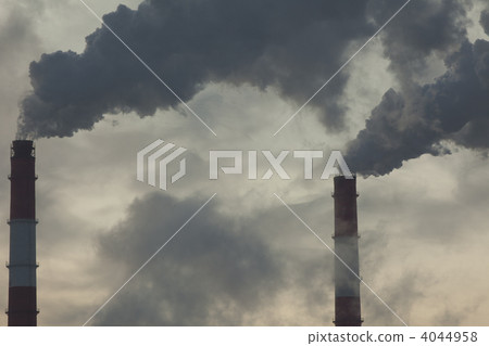 Two pipe in dark sky with smoke 4044958