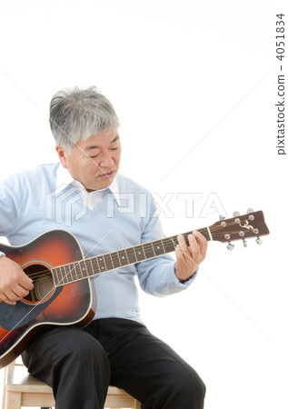 Senior men playing acoustic guitar Senior men playing acoustic guitar 4051834