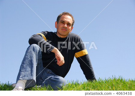 Man sitting on grass 4063438