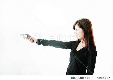 A woman with a handgun A woman with a handgun 4065176