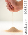 Sand from hand (vertical) 4068927