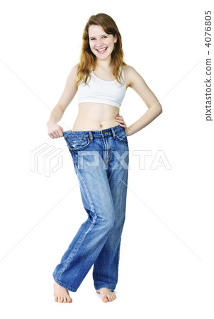 Happy girl in jeans after losing weight Happy girl in jeans after losing weight 4076805