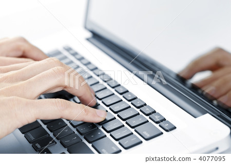 Hands typing on laptop keyboard 4077095