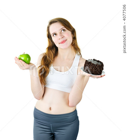 Young girl holding apple and cake 4077506