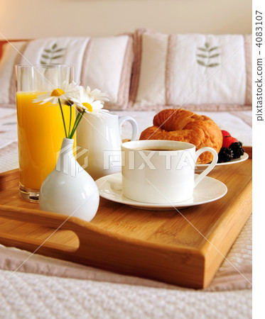 Breakfast on a bed in a hotel room 4083107