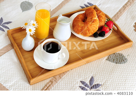 Breakfast on a bed in a hotel room 4083110