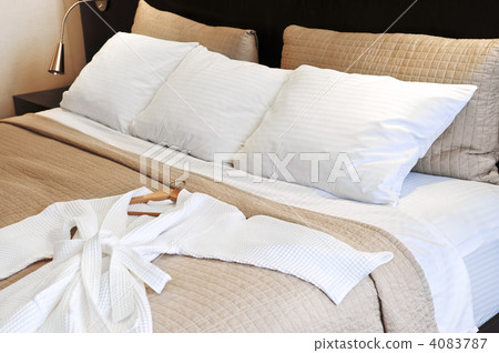 Hotel bed with bathrobe Hotel bed with bathrobe 4083787