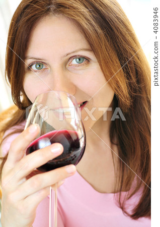 Mature woman with a glass of red wine 4083946