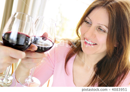 Mature woman toasting with red wine 4083951