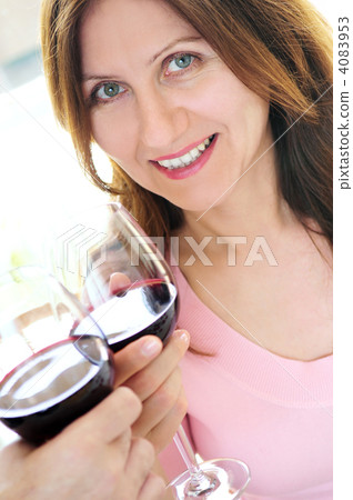 Mature woman toasting with red wine 4083953