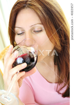 Mature woman with a glass of red wine 4083957