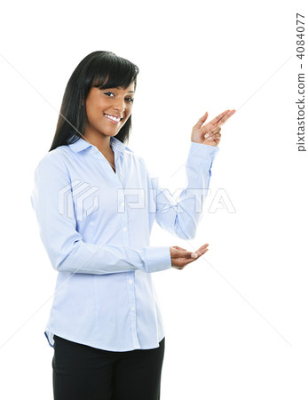 Smiling young woman pointing 4084077