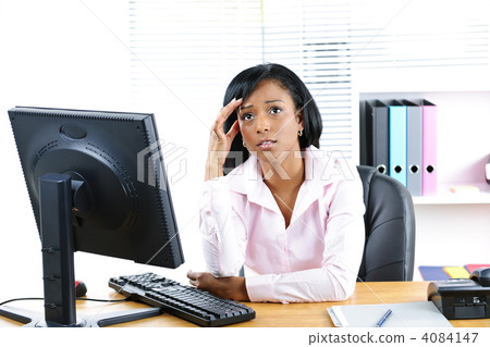 Worried black businesswoman at desk 4084147