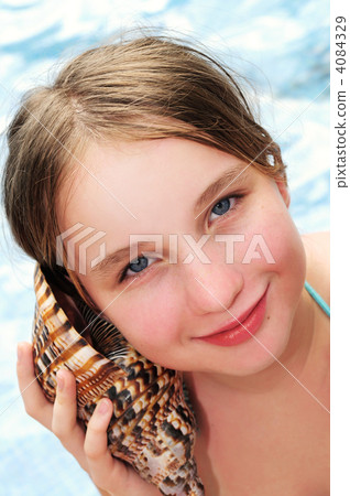 Young girl with seashell Young girl with seashell 4084329