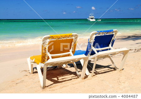 Chairs on sandy tropical beach 4084487