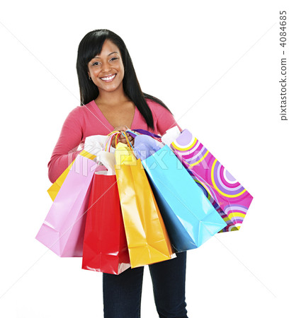 Happy young black woman with shopping bags 4084685