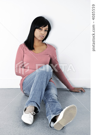 Depressed woman sitting on the floor Depressed woman sitting on the floor 4085559
