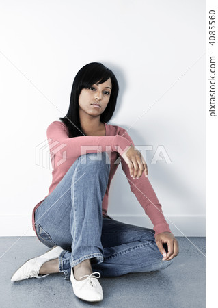 Depressed woman sitting on the floor Depressed woman sitting on the floor 4085560
