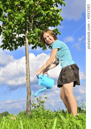Girl watering a tree 4091565