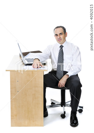 Businessman at his desk on white background Businessman at his desk on white background 4092015