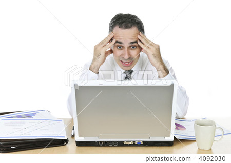 Businessman at his desk on white background 4092030