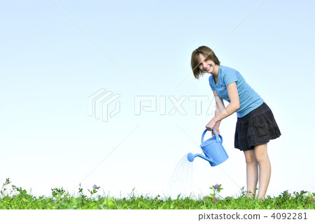 Girl with watering can 4092281