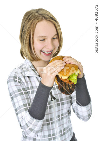 Teenage girl holding big hamburger 4092672