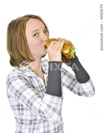 Teenage girl holding big hamburger 4092674