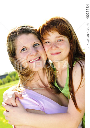 Mother and daughter hugging Mother and daughter hugging 4093384
