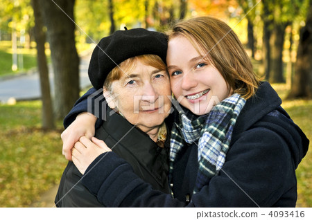 Granddaughter hugging grandmother 4093416