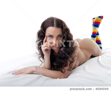Young nude woman lay in color socks isolated Young nude woman lay in color socks isolated 4094049