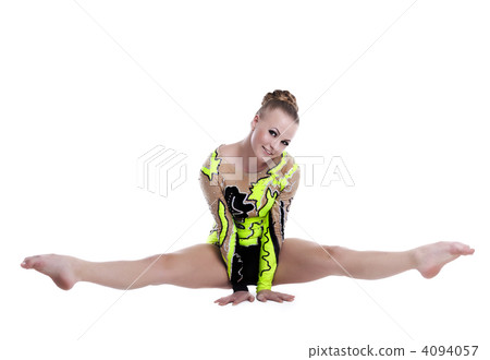 Young professional gymnast doing a splits isolated Young professional gymnast doing a splits isolated 4094057