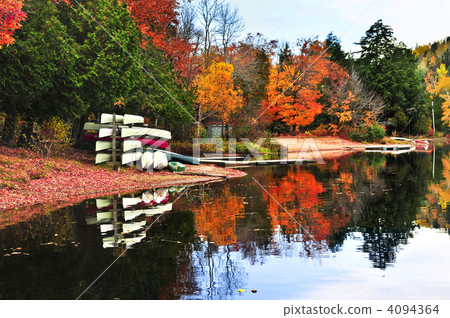 Fall forest reflections with canoes 4094364