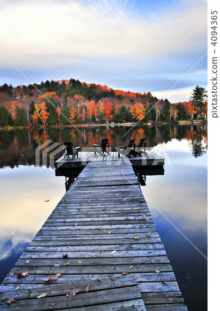 Wooden dock on autumn lake 4094365