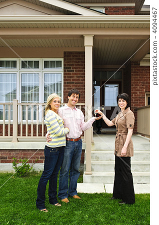Happy couple with real estate agent Happy couple with real estate agent 4094467