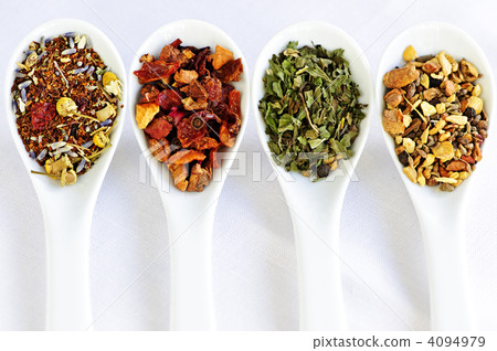 Assorted herbal wellness dry tea in spoons 4094979