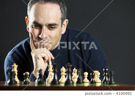 Man at chess board 4100992