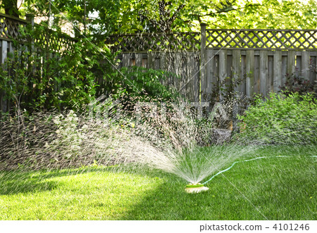 Lawn sprinkler watering grass Lawn sprinkler watering grass 4101246