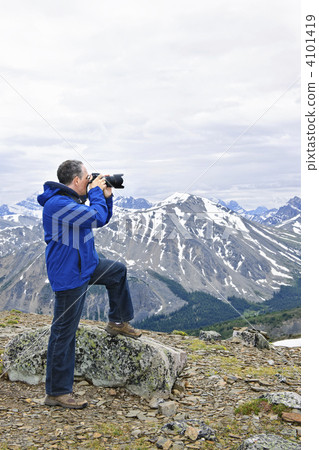 Photographer in mountains Photographer in mountains 4101419